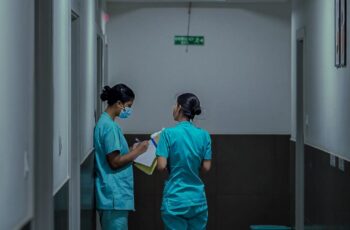 Healthcare staff in a hospital corridor