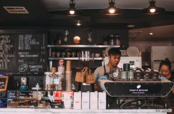 Baristas working a coffee shop counter