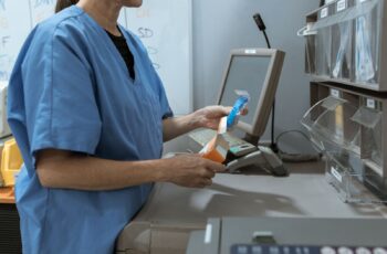 Nurse working at a supply and medication station